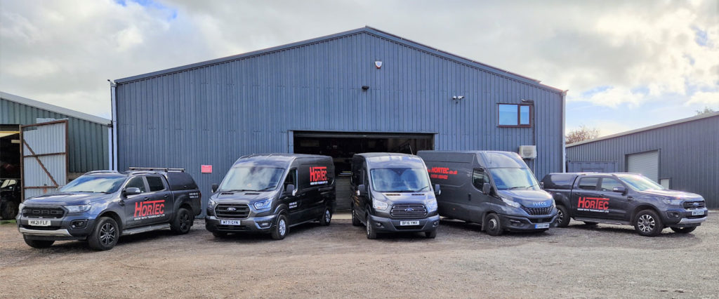 photo-of-hortec-warehouse-with-company-vehicles-parked-up-front
